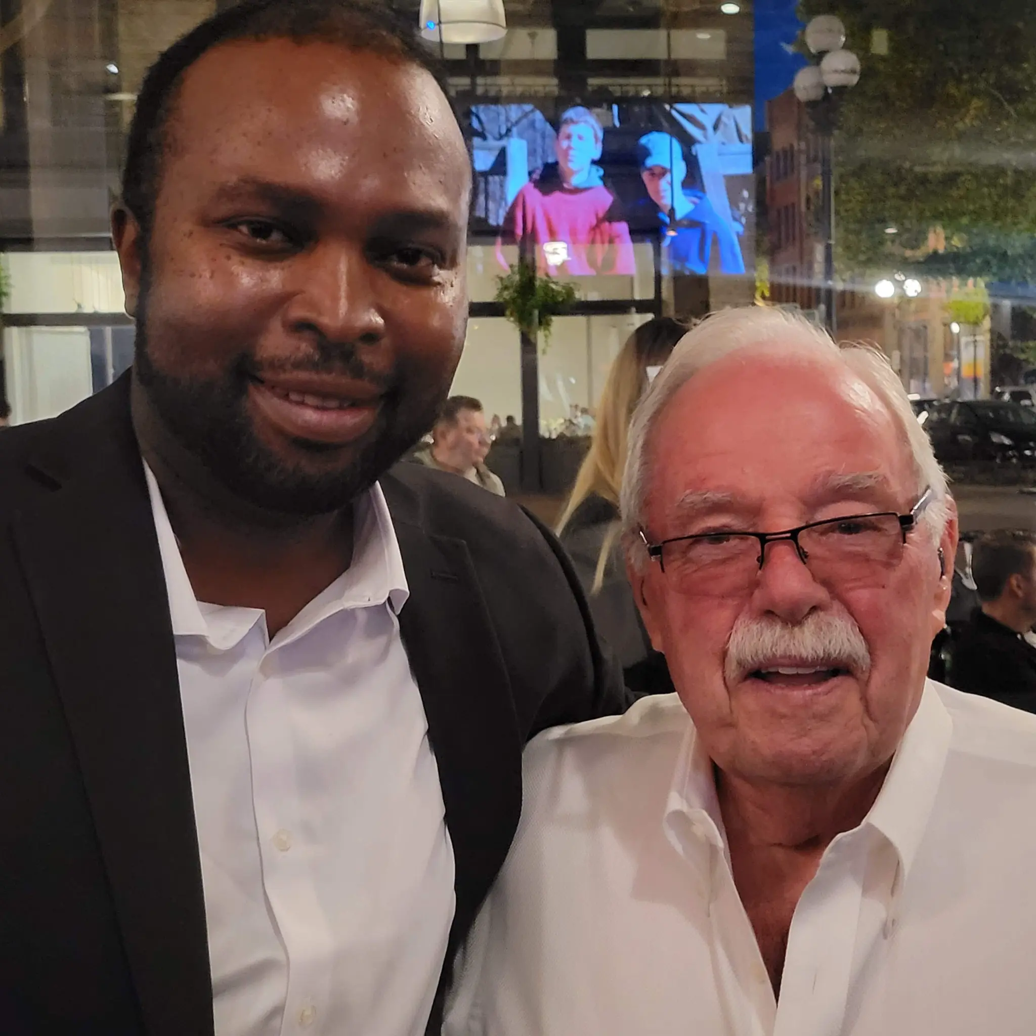 Kingsley Ndoh with Jim Sinegal, co-founder of Costco, at a gathering in downtown Seattle.